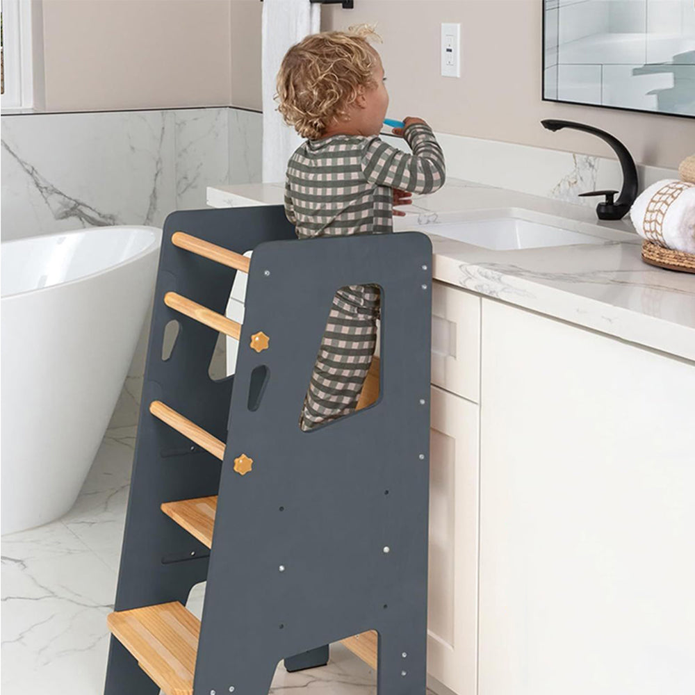 Wooden learning tower designed for toddlers to participate in daily activities